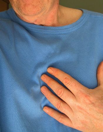 Man holding his chest
