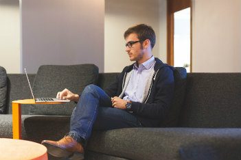 Man sitting and working on laptop